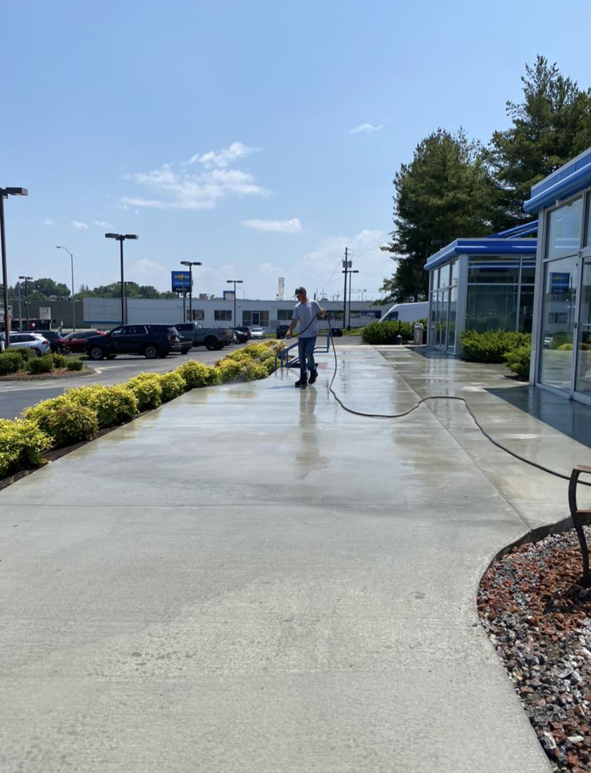 Pressure washing a commercial sidewalk