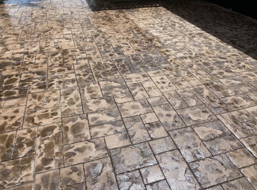 Close-up detail of stained stamped concrete texture